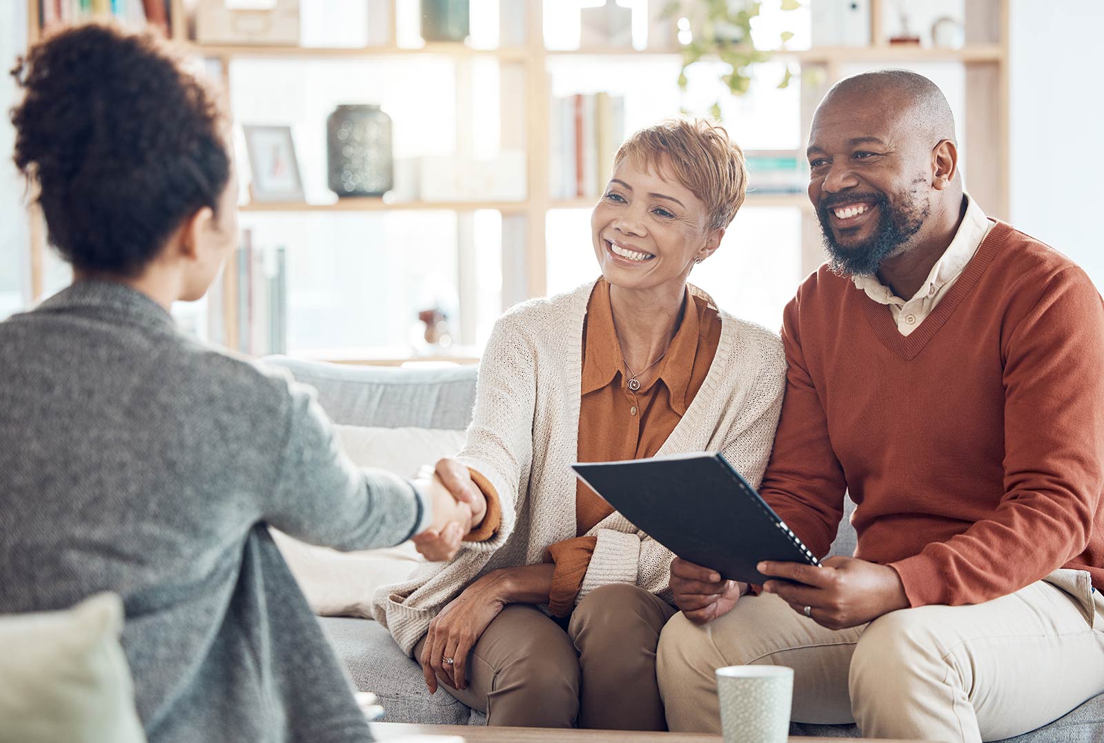 Couple speaking with financial advisor